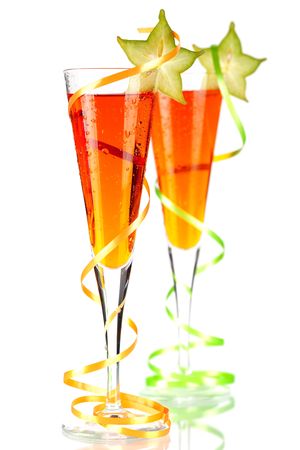 Two orange alcohol cocktails with carambola isolated on white backgroundの写真素材
