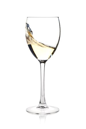Wine collection - Splashing white wine in a glass. Isolated on white backgroundの写真素材