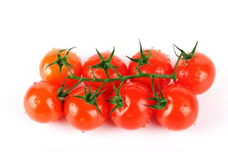 Fresh cherry tomatos isolated on white backgroundの写真素材