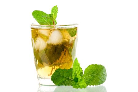 Alcohol cocktail with whiskey and mind isolated on white backgroundの写真素材