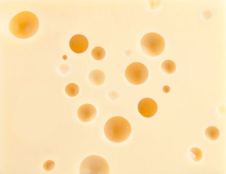 Cheese background with heart shape holesの写真素材