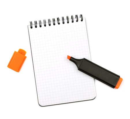 Orange marker on notepad. Isolated on white backgroundの写真素材