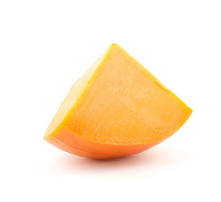 Piece of orange cheese. Isolated on white backgroundの写真素材