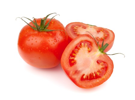 Fresh tomatoes with water drops. Isolated on white backgroundの写真素材