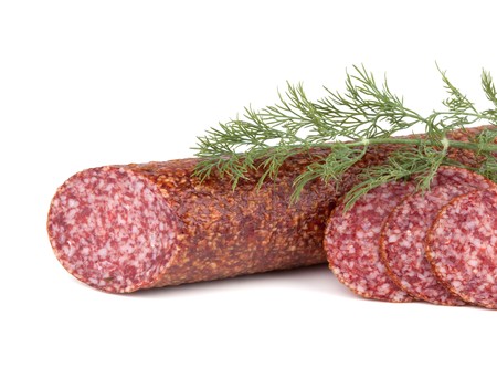 Slices italian salami sausage with dill. Isolated on white backgroundの写真素材