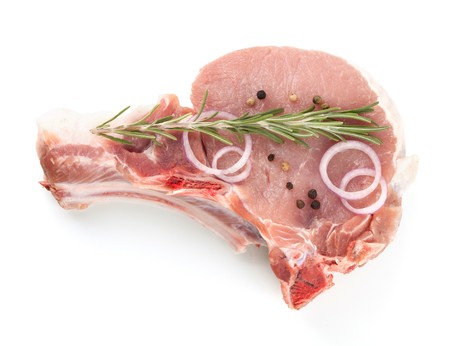 Raw meat with rosemary, pepper and onion. Isolated on whiteの写真素材
