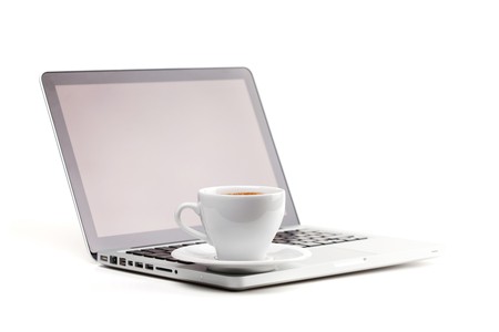 Cappuccino cup on laptop. Isolated on white backgroundの写真素材