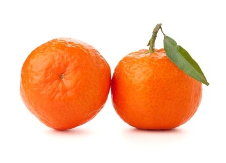 Two ripe tangerines with leafs. Isolated on whiteの写真素材