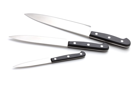 Three kitchen knives. Isolated on white backgroundの写真素材