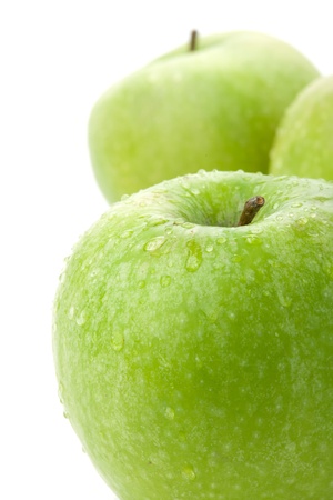 Ripe green apples closeup. Isolated on whiteの写真素材
