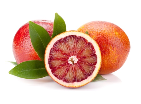 Red oranges with leafs. Isolated on white backgroundの写真素材