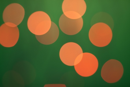 Abstract bokeh on dark green backgroundの写真素材