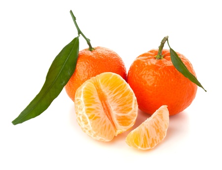 Ripe tangerine with green leaf. Isolated on whiteの写真素材