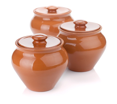 Three clay pots. Isolated on white backgroundの写真素材