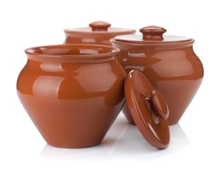 Three clay pots. Isolated on white backgroundの写真素材