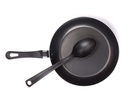 Frying pan with utensil. View from above. Isolated on white backgroundの写真素材