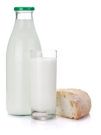 Milk bottle, glass and bread. Isolated on white backgroundの写真素材
