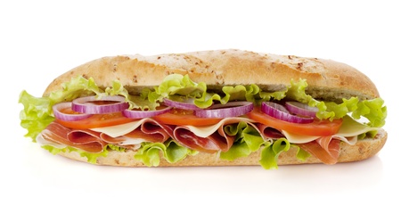 Long sandwich with ham, cheese, tomatoes, red onion and lettuce. Isolated on white. Another angle availableの写真素材