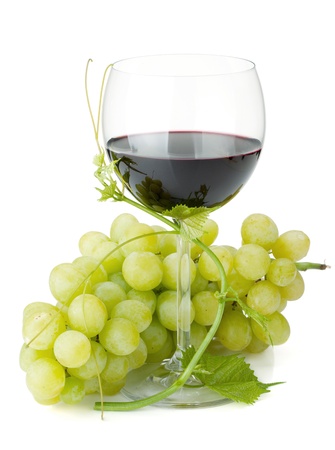 Red wine glass and grapes. Isolated on white backgroundの写真素材