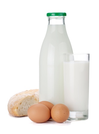 Milk bottle, glass, eggs and bread. Isolated on white backgroundの写真素材