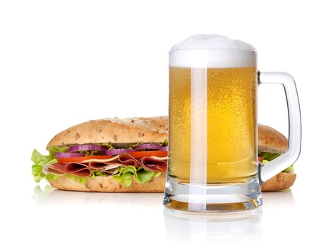 Cold lager beer glass and long sandwich. Isolated on white backgroundの写真素材