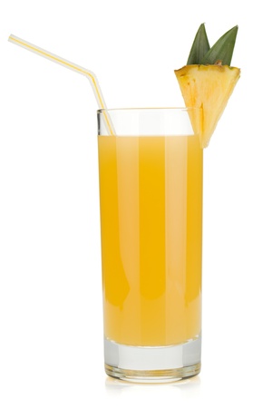 Pineapple juice in a glass with drinking straw. Isolated on white backgroundの写真素材