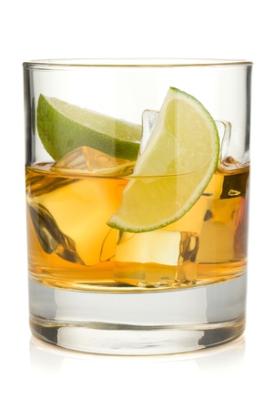 Whiskey cocktail with lime. Isolated on white backgroundの写真素材