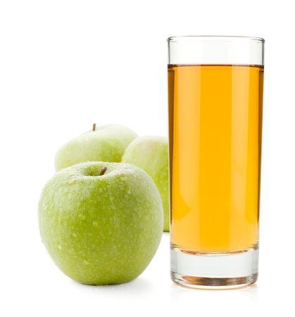 Apple juice in glass and green apples. Isolated on white backgroundの写真素材