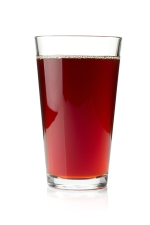 Pomegranate juice in a glass. Isolated on white backgroundの写真素材