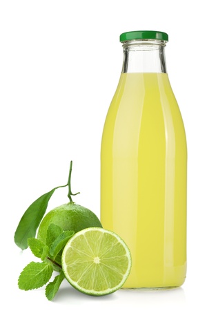 Lemon juice glass bottle, ripe limes and mint. Isolated on white background