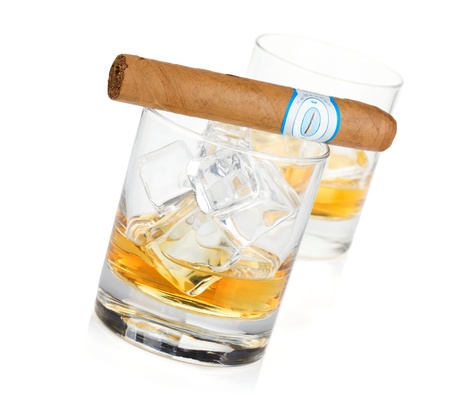 Two whiskey glasses and cigar. Isolated on white backgroundの写真素材