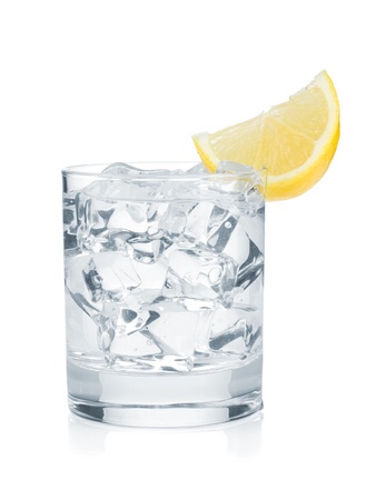 Glass of pure water with ice cubes and lemon slice. Isolated on white backgroundの写真素材