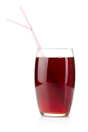 Pomegranate juice in a glass with two drinking straws. Isolated on white backgroundの写真素材