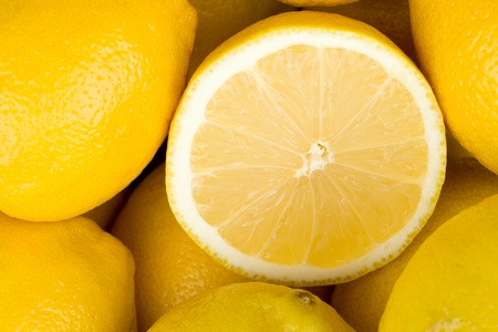 Juice ripe lemons closeup backgroundの写真素材