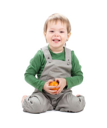 Baby with orange  Isolated on white backgroundの写真素材