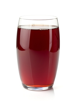 Pomegranate juice in a glass. Isolated on white backgroundの写真素材