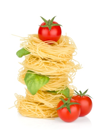 Italian pasta, tomatoes and basil. Isolated on white backgroundの写真素材