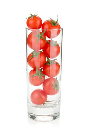 Cherry tomatoes in cocktail glass. Isolated on white backgroundの写真素材