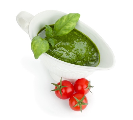 Pesto sauce and cherry tomatoes. View from above. Isolated on white backgroundの写真素材