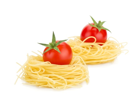 Cherry tomatoes on pasta. Isolated on white backgroundの写真素材