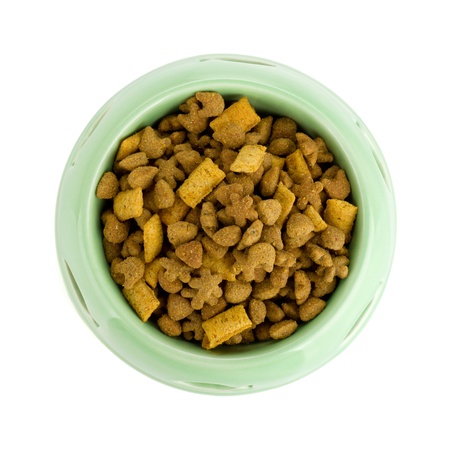 Cat food in a bowl. View from above. Isolated on white backgroundの写真素材