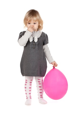 Baby girl with pink balloon. Isolated on white backgroundの写真素材