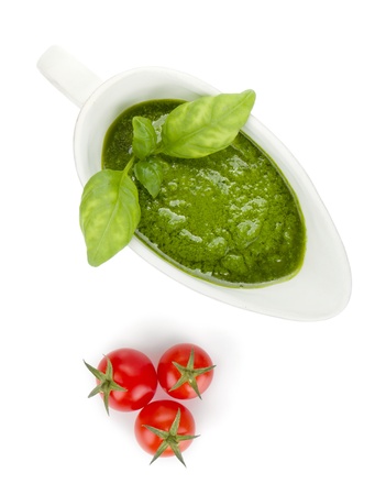Pesto sauce and cherry tomatoes. View from above. Isolated on white backgroundの写真素材