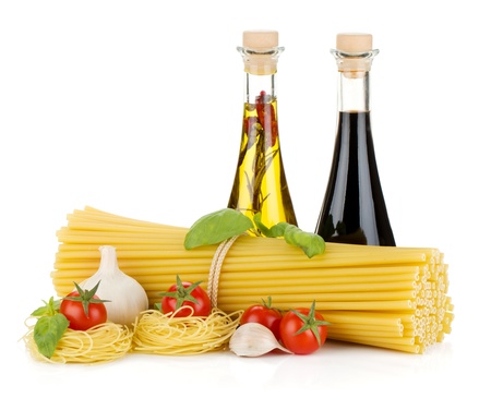 Pasta, tomatoes, basil, olive oil, vinegar and garlic  Isolated on white backgroundの写真素材