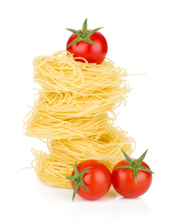 Cherry tomatoes and pasta. Isolated on white backgroundの写真素材