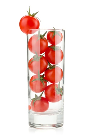 Cherry tomatoes in cocktail glass. Isolated on white backgroundの写真素材