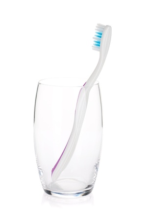 Toothbrush in a glass. Isolated on white backgroundの写真素材