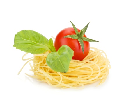 Cherry tomato, basil and pasta. Isolated on white backgroundの写真素材