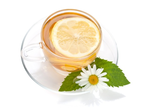Cup of tea with lemon slice, mint leaves and chamomile flower  Isolated on white backgroundの写真素材