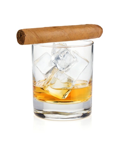 Whiskey glass and cigar. Isolated on white backgroundの写真素材